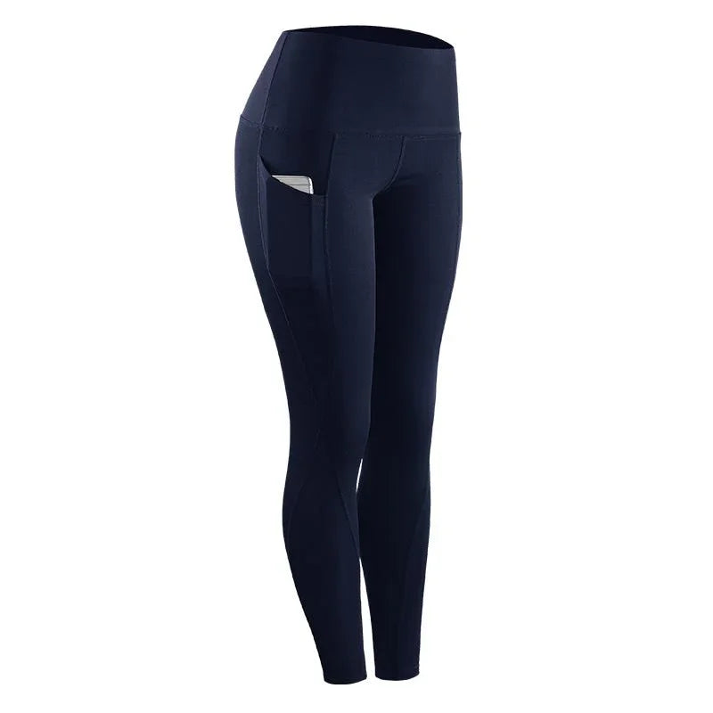 Navy blue high-waisted women's fitness leggings with side pocket holding a phone
