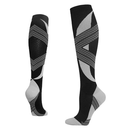 Black, gray, and white knee-high socks on a white background