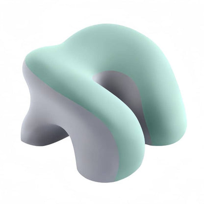Geometric abstract sculpture in pastel green and gray on a white background