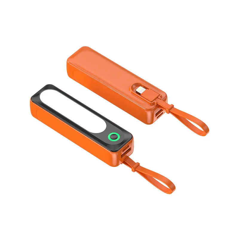 Portable orange rechargeable LED flashlight with strap and USB charging port.