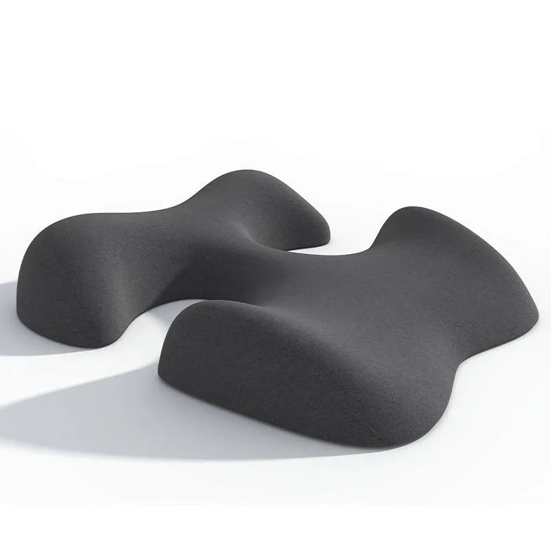 Contoured black foam exercise equipment for stretching and core workouts on white background.