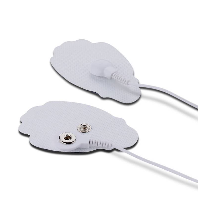 Two electronic adhesive patches with leads on a white background