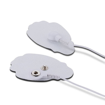 Two electronic adhesive patches with leads on a white background