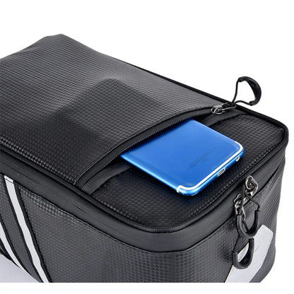 Black textured fitness gear bag with zippered pocket, blue phone inside