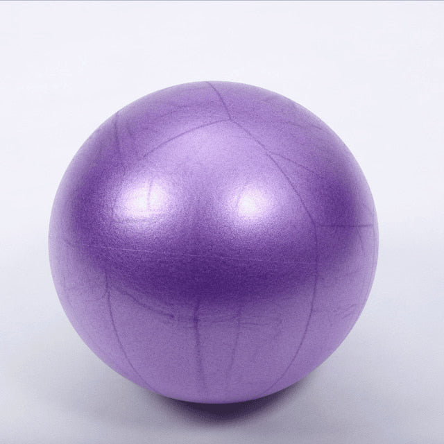 Purple exercise ball on a white background