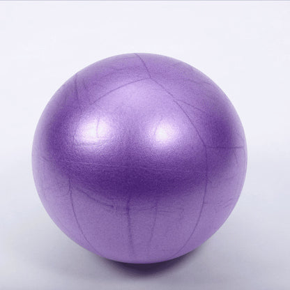 Purple exercise ball on a white background