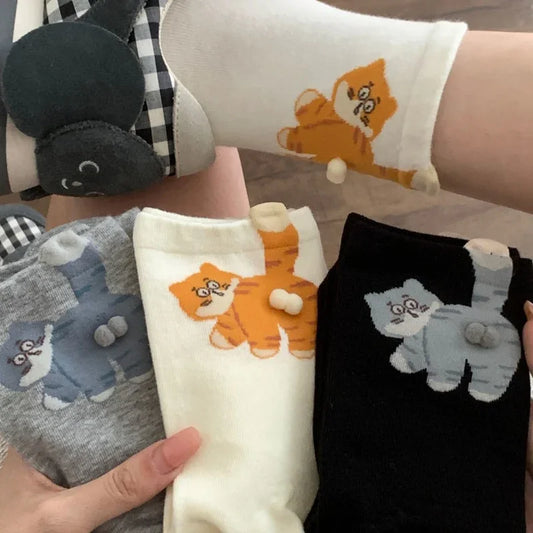 Cute cat print ankle socks in gray, white, and black with 3D tail detail