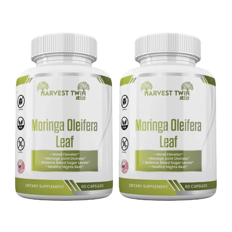 Two white plastic bottles of Harvest Twin Labs Moringa Oleifera Leaf dietary supplement, side by side on a white background.