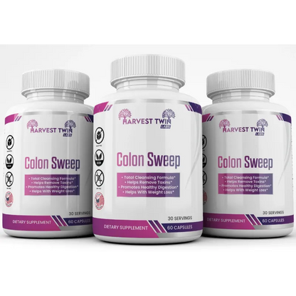 Three white bottles of Harvest Twin Labs Colon Sweep dietary supplement capsules, with the center bottle featured prominently and the two on either side slightly blurred.
