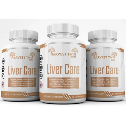 Three white bottles of Harvest Twin Labs Liver Care dietary supplement arranged side by side on a solid black background.