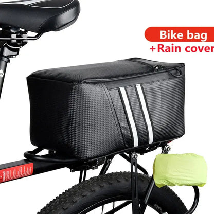 Rear bike rack bag with reflective stripes and rain cover, mounted on bicycle.