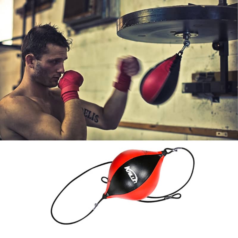 Man training with a boxing speed bag in a gym setting