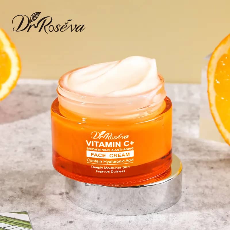 Dr Roseva Vitamin C+ face cream jar with oranges in the background