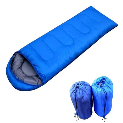Blue outdoor sleeping bag with grey interior and two compact carrying bags