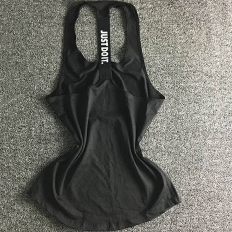Black racerback gym tank top with 'JUST DO IT.' text on back, fitness apparel on grey background