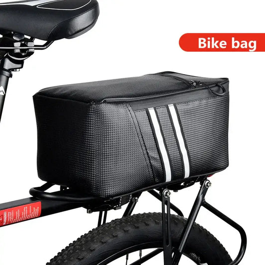Black bike rack bag with reflective stripes mounted on rear bicycle carrier