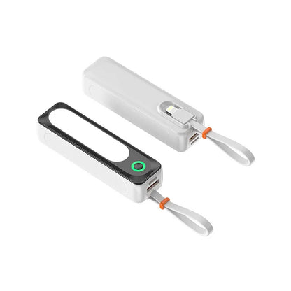 Portable white power bank with USB ports, attached charging cable, and carrying strap