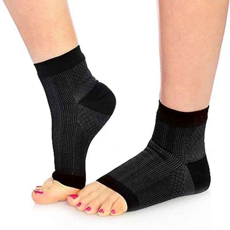 Black compression ankle sleeves for plantar fasciitis on feet, open toe design