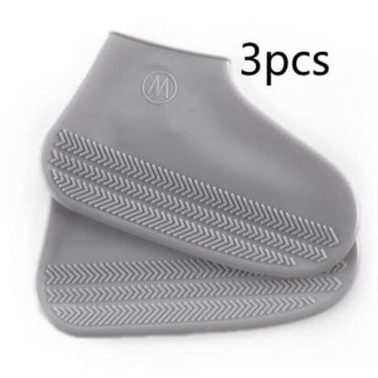 Three gray silicone mats with textured surface and brand logo on a white background
