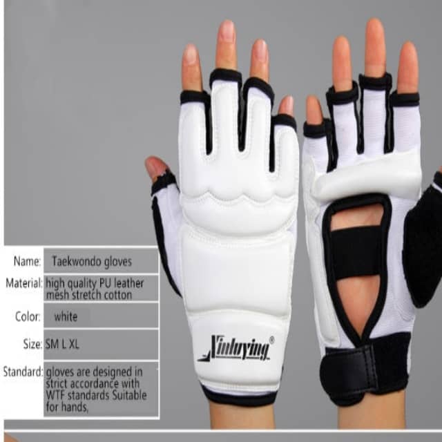 Pair of white taekwondo gloves with black accents on a gray background