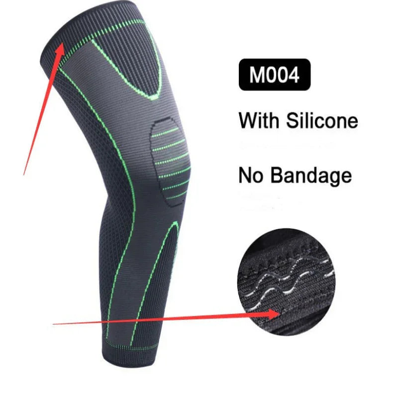 Black knee support sleeve with green stitching, silicone grip, and no bandage design