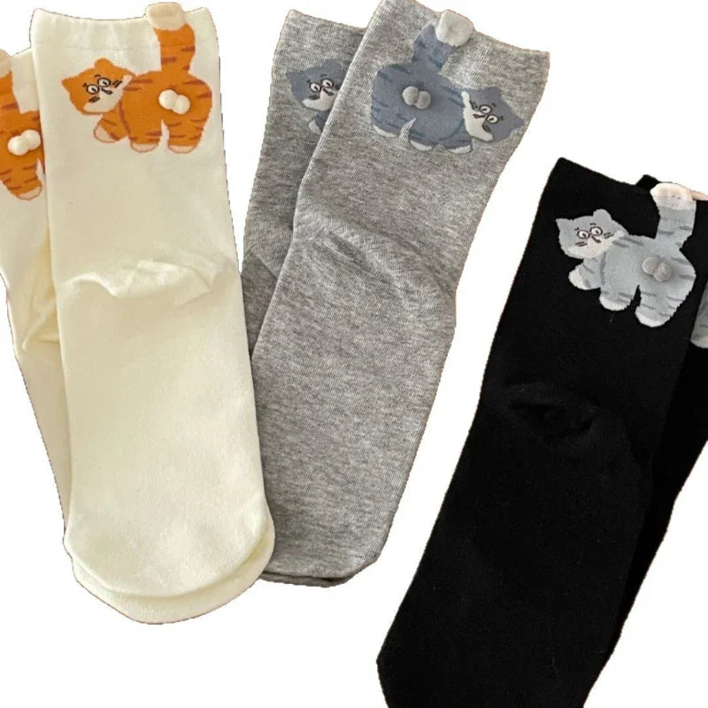 Assorted cat print socks in cream, grey, and black colors, cute animal-themed accessories