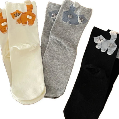 Assorted cat print socks in cream, grey, and black colors, cute animal-themed accessories
