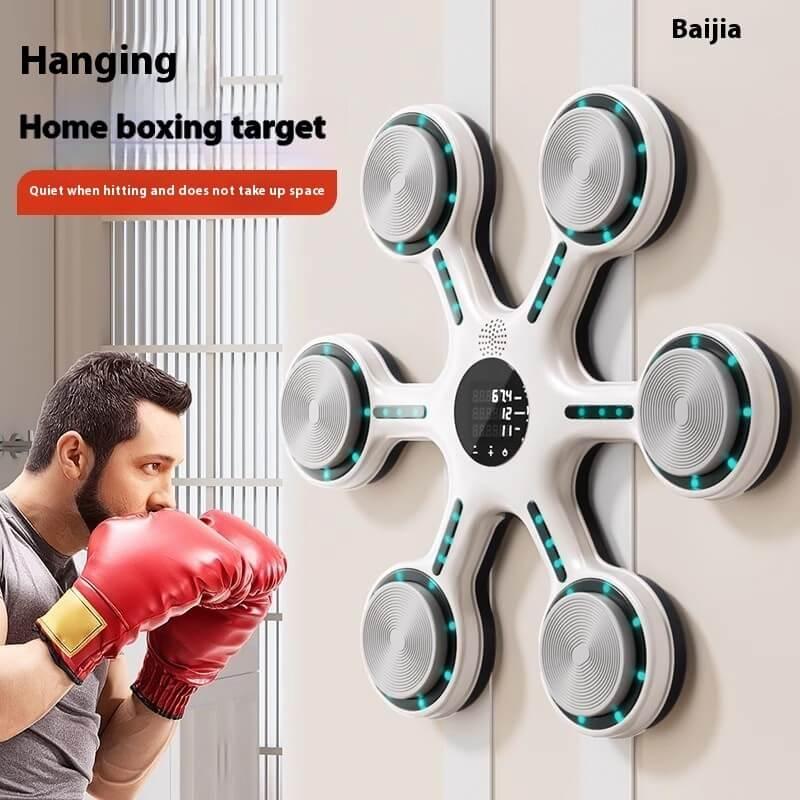 Man training with wall-mounted electronic boxing target and red gloves, home fitness equipment