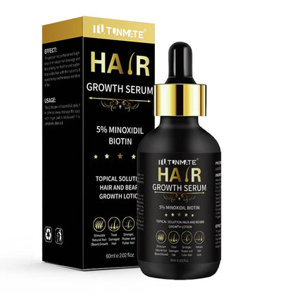 Hair growth serum bottle and packaging with gold accents on a white background