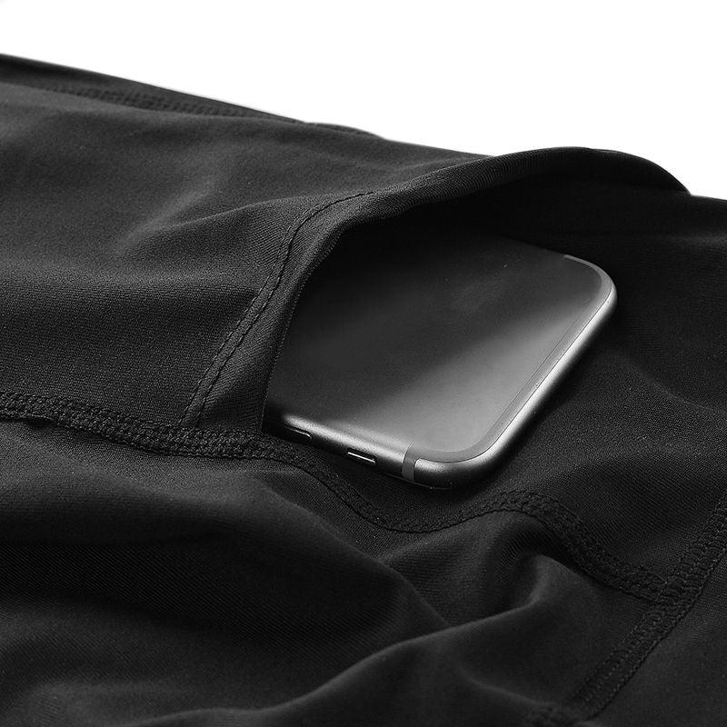 Black fitness leggings pocket holding a smartphone, showcasing workout gear convenience