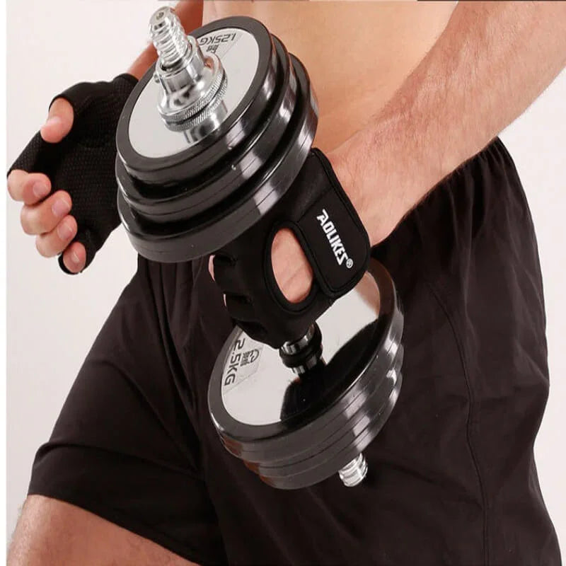 Person holding a black and silver adjustable dumbbell with a white background