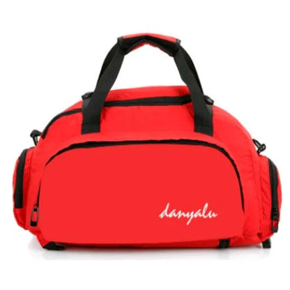 Red gym duffel bag with black handles and side pockets, sporty fitness gear
