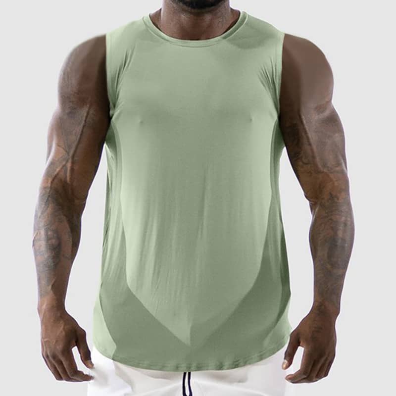 Person wearing a green sleeveless shirt on a white background