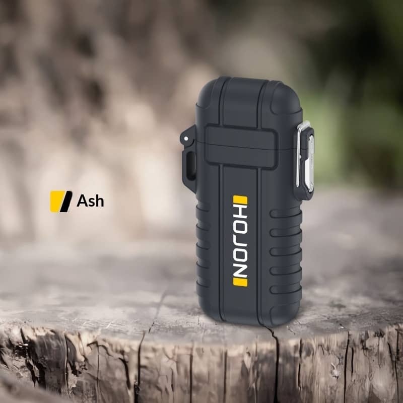Black lighter with 'Holon' branding on a wooden surface