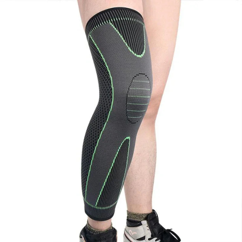 Athlete wearing a black and green knee compression sleeve for fitness support