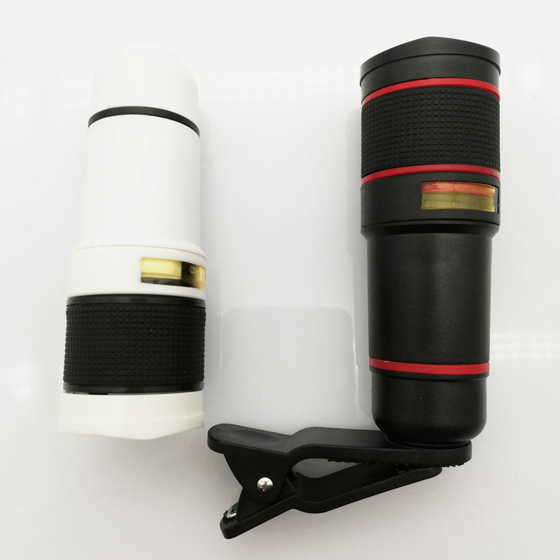 Two phone camera lenses with a clip on a white background