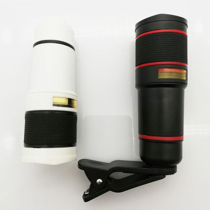 Two phone camera lenses with a clip on a white background