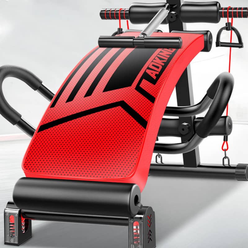 Red and black exercise machine with 'Adkron' branding on a light gray background