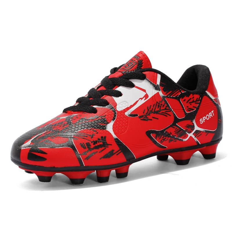 Red and black soccer cleat on a white background