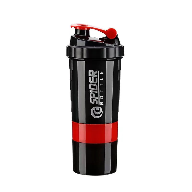 A black shaker bottle with a red accent band and a red flip-top lid, featuring the 'SPIDER BOTTLE' logo printed vertically on the side, set against a plain white background.