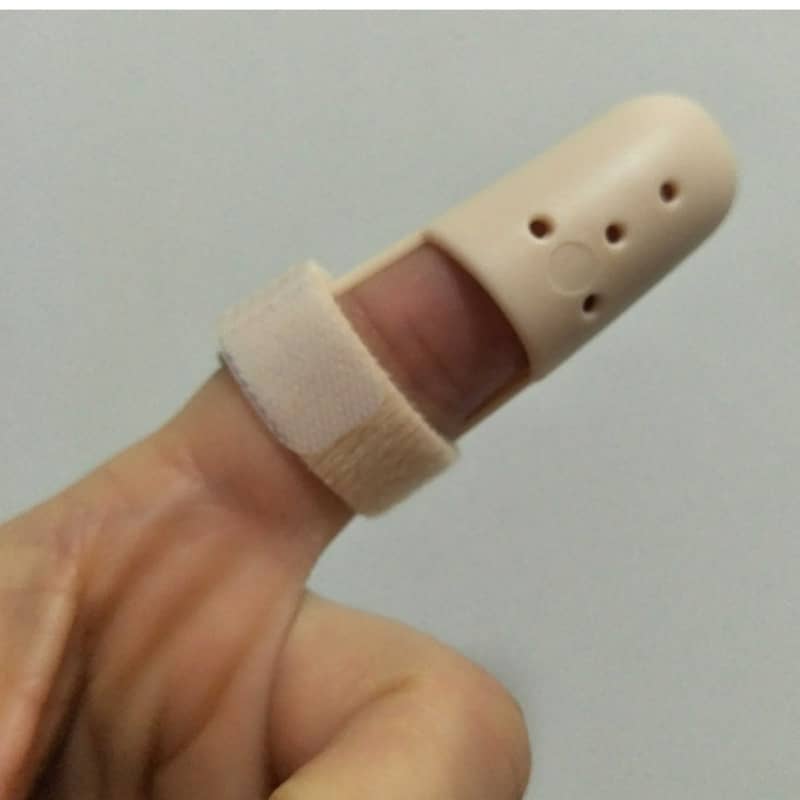 Beige finger protector on a finger against a plain background