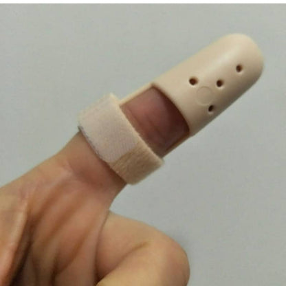 Beige finger protector on a finger against a plain background