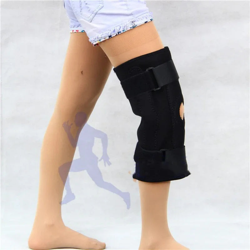 Person wearing adjustable black knee brace support for fitness and injury recovery