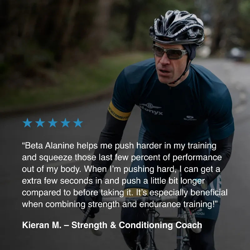 A cyclist wearing a black and white helmet, sunglasses, and a dark cycling jersey rides on a road. A testimonial quote from Kieran M.