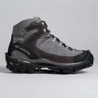 A high-top Scarpa hiking boot in gray suede and mesh with black rubber toe and sole, shown from a side profile on a light gray background.