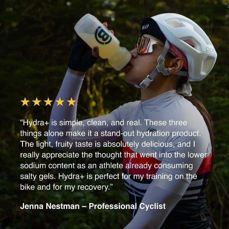 A professional cyclist outdoors drinking from a white bottle with a green logo. The image includes a five-star rating and a testimonial quote from Jenna Nestman, Professional Cyclist, with the brand name Hydra+ visible on the bottle.