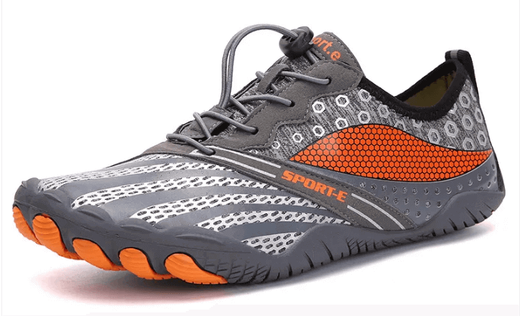 Lightweight gray and orange athletic shoe with breathable mesh and flexible sole.