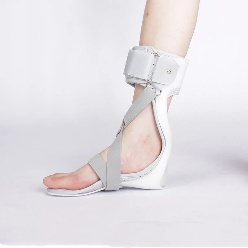 White sandal with gray straps on a white background