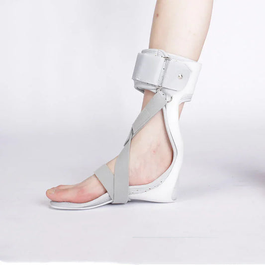 White sandal with gray straps on a white background
