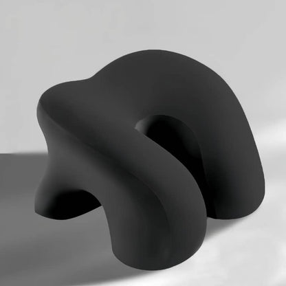 Black, abstract-shaped object on a gray background